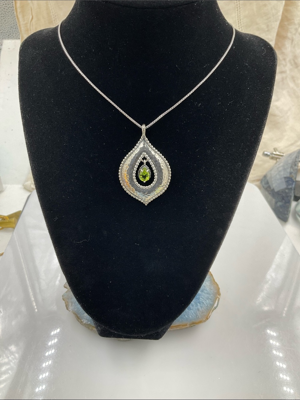 Sterling Silver Teardrop Pendant Necklace Featuring A Faceted Peridot Gemstone